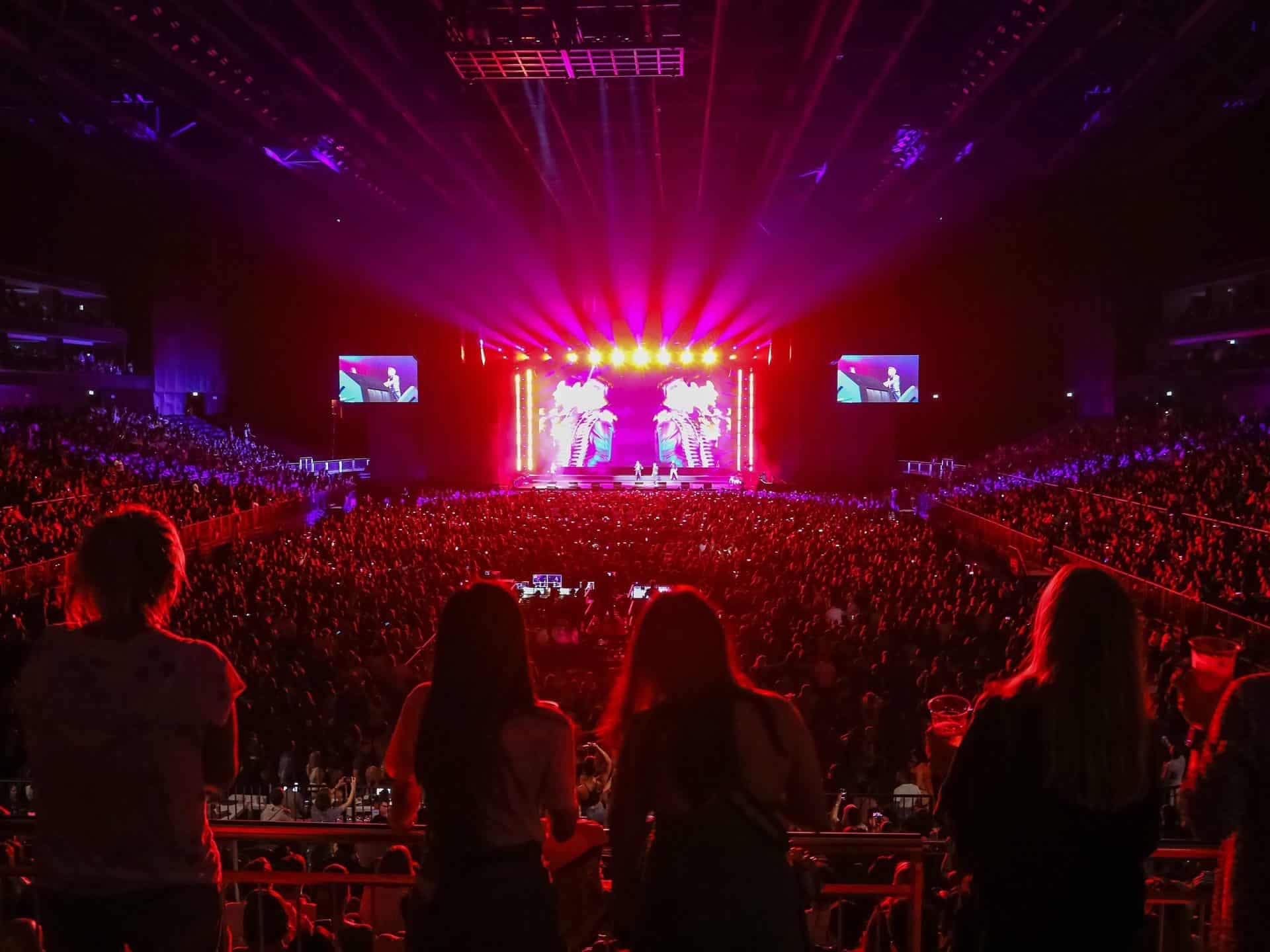Crowd inside an arena watching a live performance